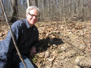 Sean Solomon with blooming Bloodroot in Morris Park, Philadelphia Pa