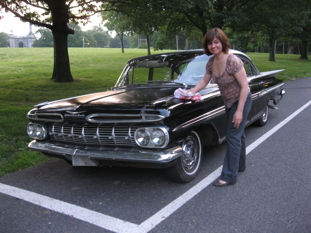 Isabelle buffs up our 1959 Chevrolet Impala in West Fairmount Park